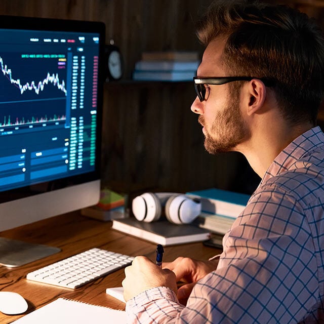 man looking at financial chart